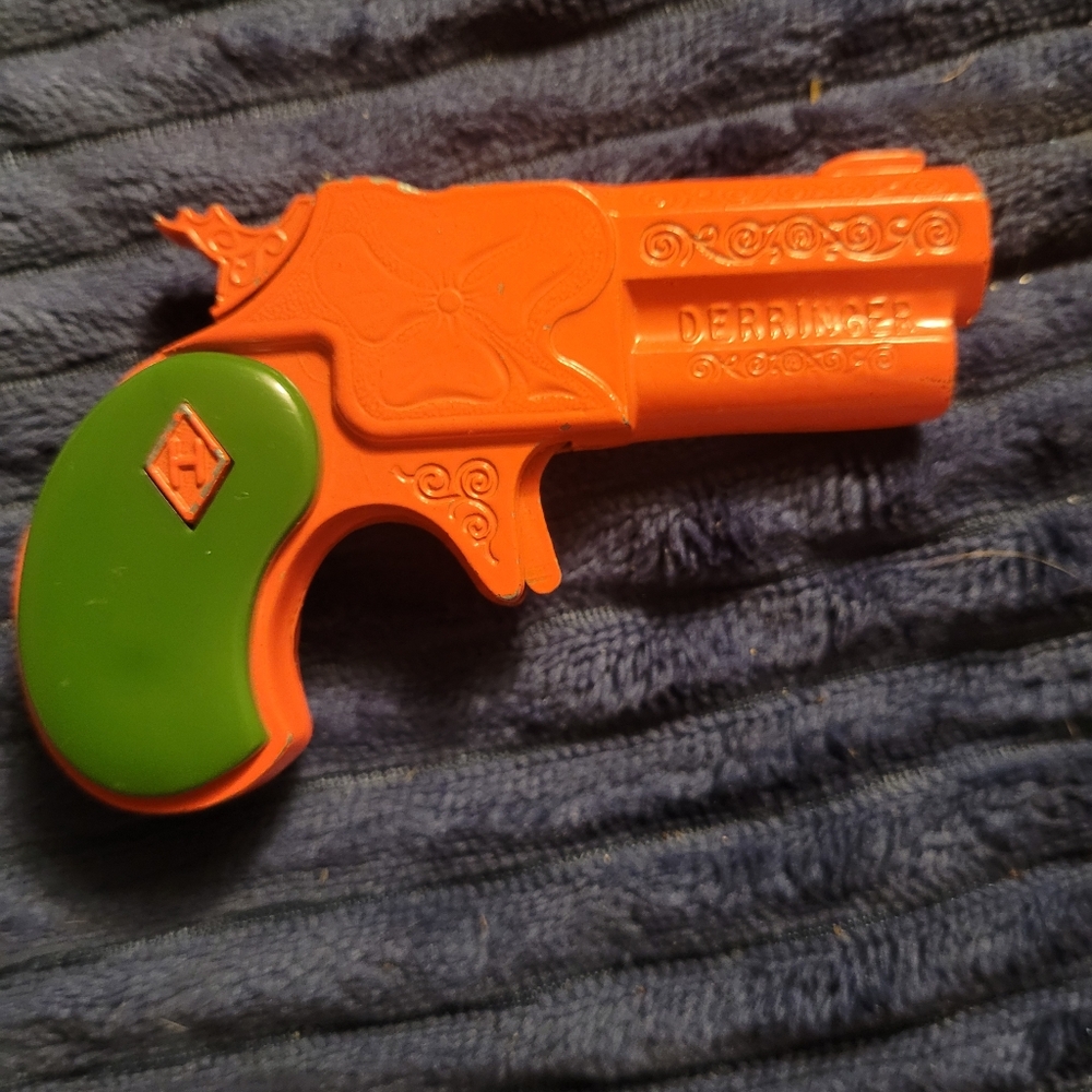 Orange and Green Toy Pistol